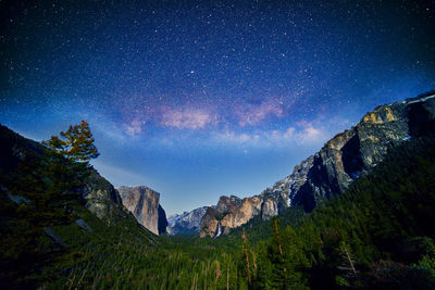 Scenic view of mountains against sky at night