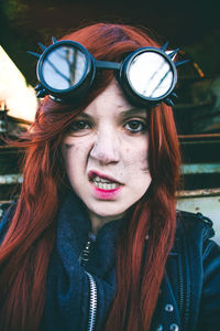 Woman making face wearing sunglasses