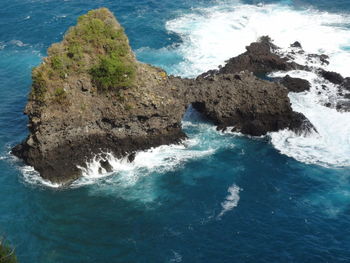 High angle view of rock formation in sea