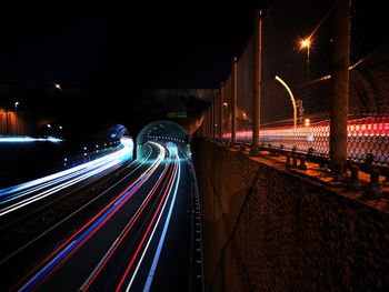 High angle view of light trails on road at night