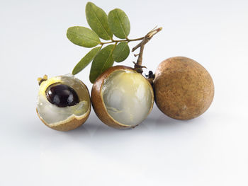 Close-up of fruits against white background