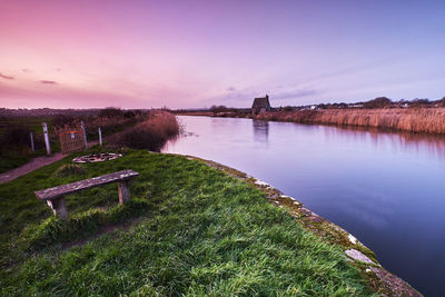 Scenic view of lake against sky during sunset