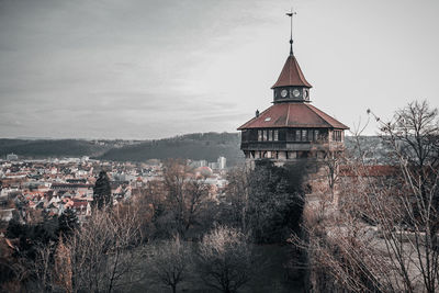 High angle view of old building and trees against sky