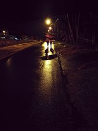 Man standing at night