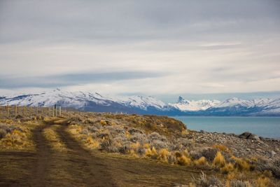 Scenic view of snowcapped mountains against sky