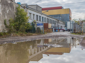 Reflection of buildings in puddle