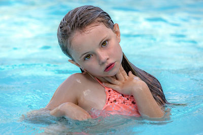 Close-up of girl swimming in sea