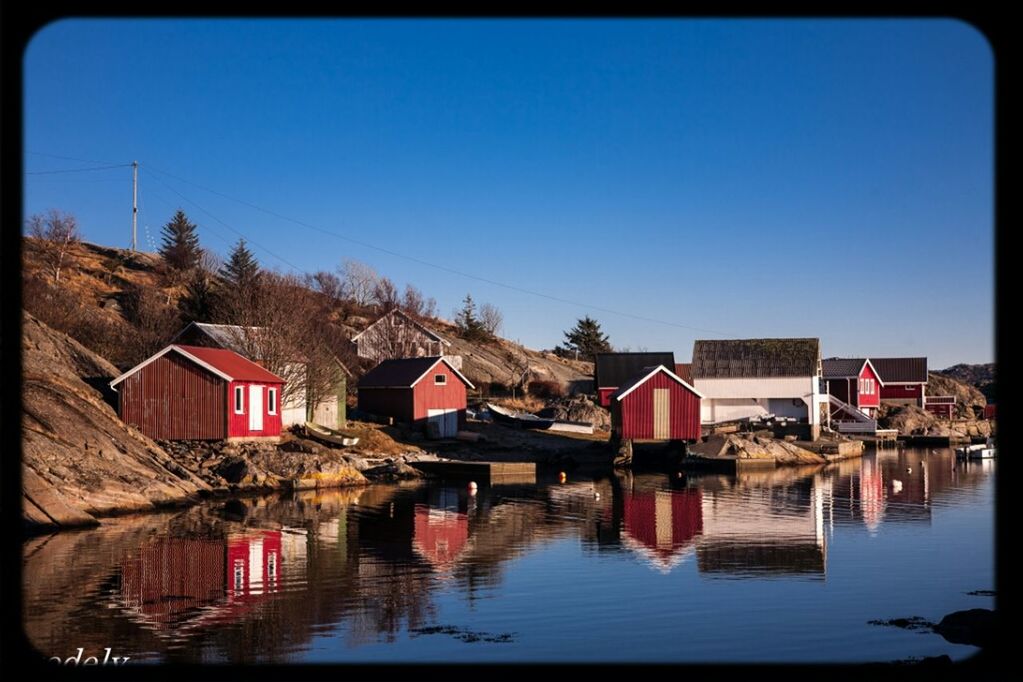 architecture, built structure, clear sky, building exterior, water, house, blue, copy space, residential structure, reflection, waterfront, residential building, auto post production filter, day, roof, no people, outdoors, sky, transfer print, lake