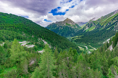 Scenic view of green landscape against sky