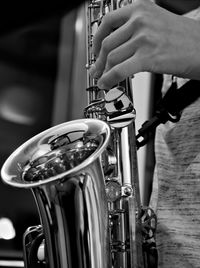 Close-up of person playing saxophone