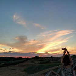 Scenic view of landscape at sunset