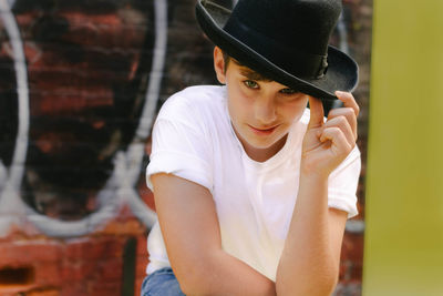 Portrait of young man wearing hat