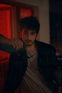 Portrait of young man looking straight to camera. 