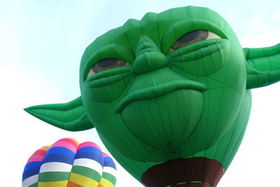 Low angle view of hot air balloons against sky