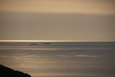 Scenic view of sea at sunset