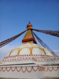 Low angle view of a building against blue sky