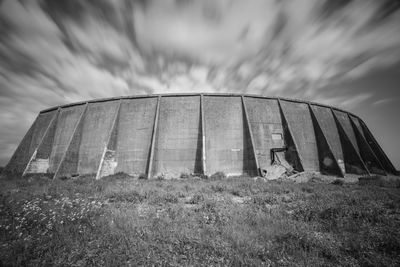 Sound mirrors at greatstone lake against cloudy sky