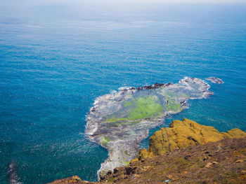 Scenic view of sea against blue sky