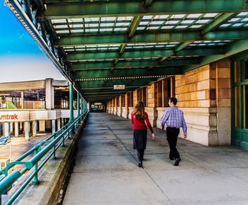 People walking on footbridge