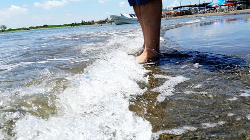 Low section of person in sea
