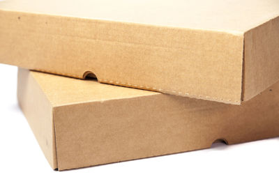 Close-up of boxes over white background