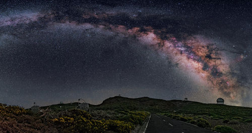 View of starry sky over landscape at night