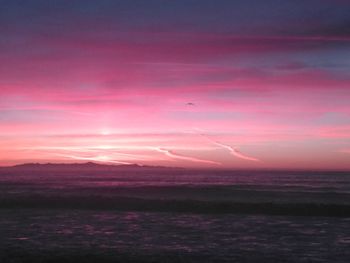 Scenic view of sea against orange sky