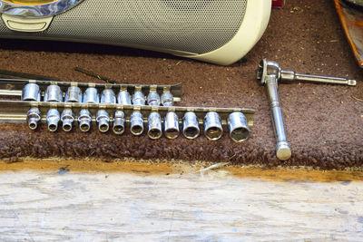 High angle view of hand tools on carpet