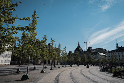 Panoramic view of trees and buildings against sky