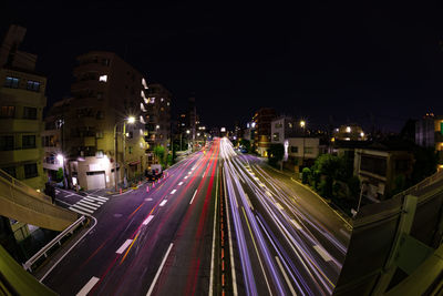 High angle view of light trails on road at night