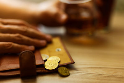 Fired man countsing his last money to drink expensive alcohol.