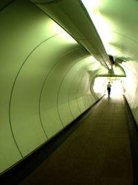 Woman walking in tunnel