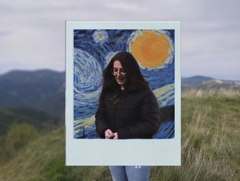 Portrait of smiling woman standing on land