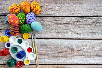 High angle view of multi colored eggs on table