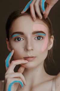 Close-up portrait of woman with face paint