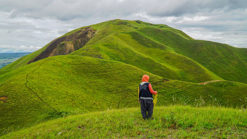 Full length of a man walking in a field