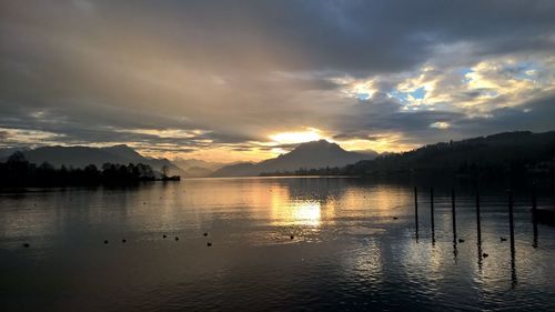 Scenic view of lake against sky during sunset