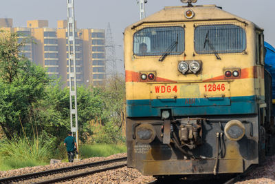 Train on railroad track in city