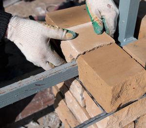 High angle view of hand working on wood