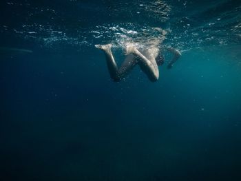 Woman swimming in sea