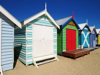 Beach huts against blue sky. brighton beach bathing boxes, victoria.