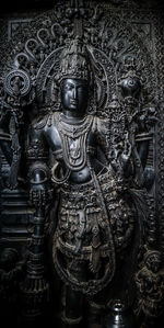 Buddha statue in temple outside building