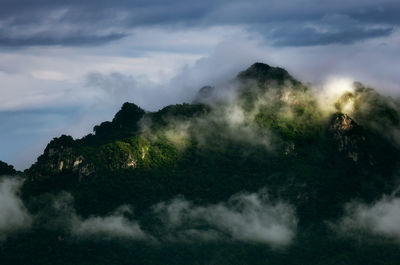 Beautiful landscape in the morning time during sunrise with fog above the mountain, 