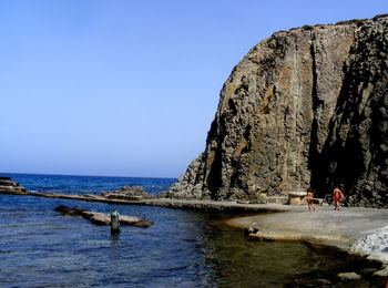 Scenic view of sea against clear blue sky