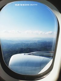 Aerial view of sky seen through airplane window