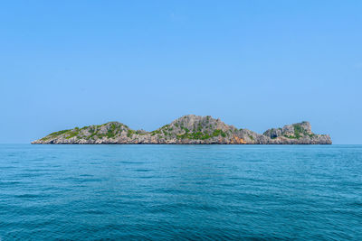 Scenic view of sea against clear blue sky