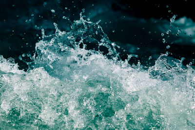 Close-up of water splashing in sea