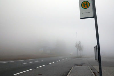 Bus station on a foggy day