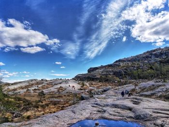 Scenic view of rocky mountains against blue sky