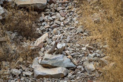 High angle view of stones on field